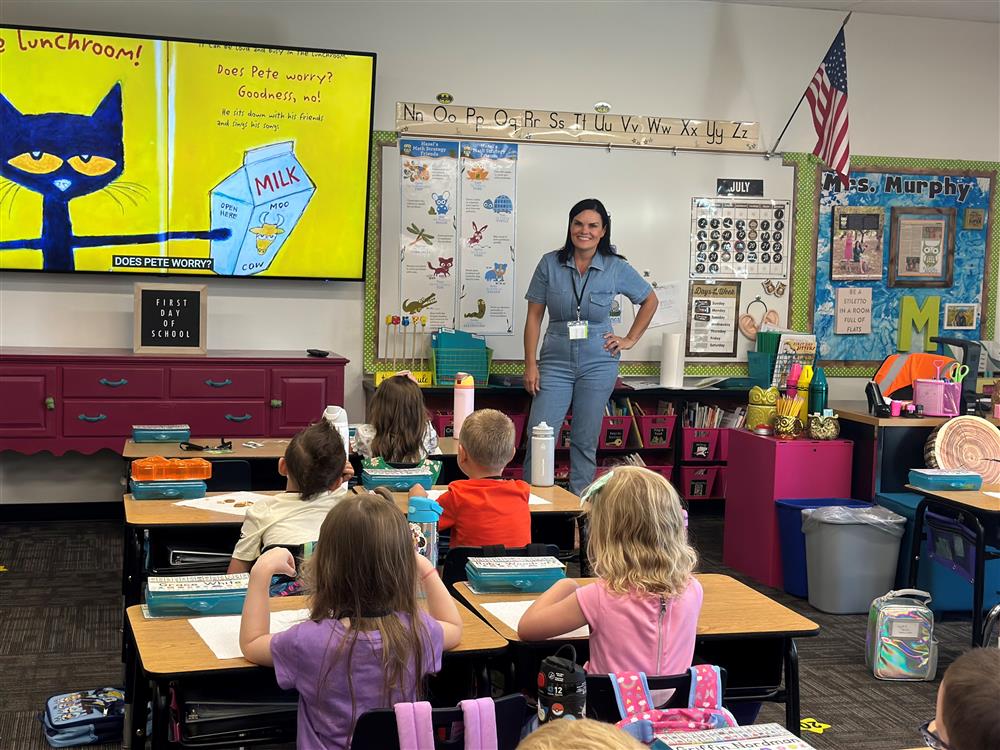 A teacher smiles while teaching at Robert Rice Elementary School